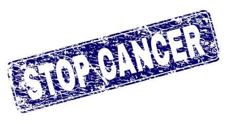 STOP CANCER stamp seal watermark with grunge texture. Seal shape is a rounded rectangle with frame. Blue vector rubber print of STOP CANCER caption with grunge style.