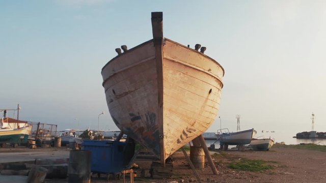 Wide shot bow of traditional carvel built sailing boat Sapele timber planking