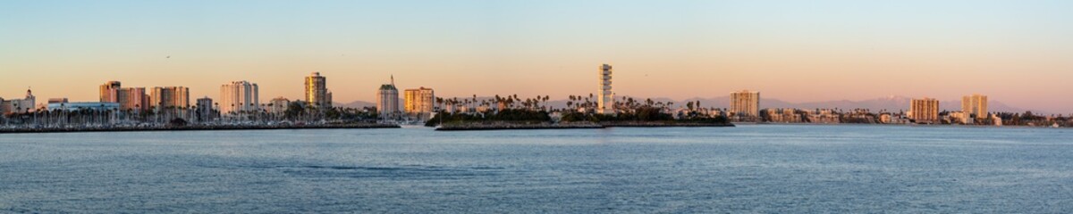 Fototapeta na wymiar Panorama of Long Beach harbor as seen from a boat at sunset.