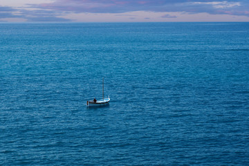 Fisherman in Small Boat in Ocean