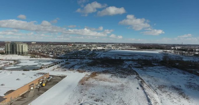 Big Clouds Quickly Moving Over Winter Landscape Aerial View