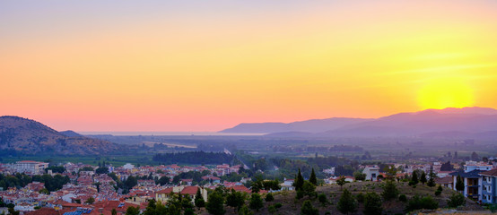 Selcuk, Turkey. Panorama of the view of the city and the mountains at sunset.