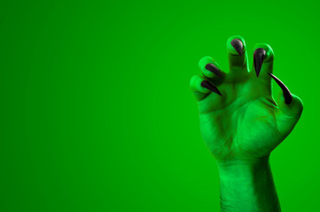 Halloween, nightmare creature and evil monster horror story concept with a scary zombie or demon...