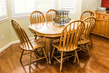 Wooden Table And Chairs On Rich Hardwood Floor