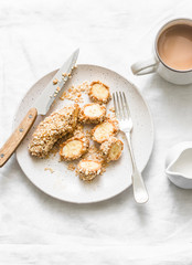 Healthy protein snack, breakfast - peanut butter, seeds, banana nut bites on a light background, top view
