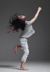 Happy Asian little girl playing in the studio
