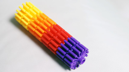 Purple, red, orange and yellow plastic bars