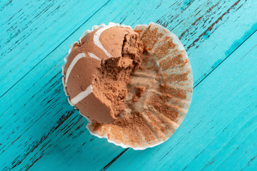 the bottom paper for a cup cake on blue background