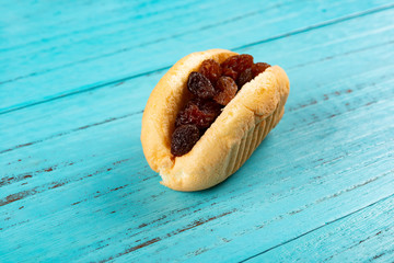 cake with raisin on blue table