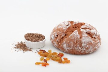 Baguette with raisins on a white background