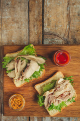 sandwich with chicken and lettuce. food background. copy space