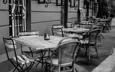 Modern rustic restaurant - coffee shop chairs and tables in black and white wide shot