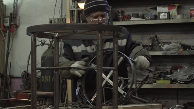 Male Blacksmith Is Working On His New Forged Products