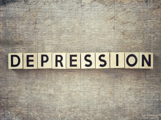 Motivational and inspirational word - Depression written on wooden blocks and arranged on a wooden...