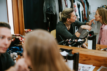 Model sitting down for her makeup