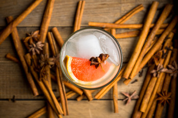 Fresh cocktail with grapefruits on the rustic background. Selective focus. Shallow depth of field..