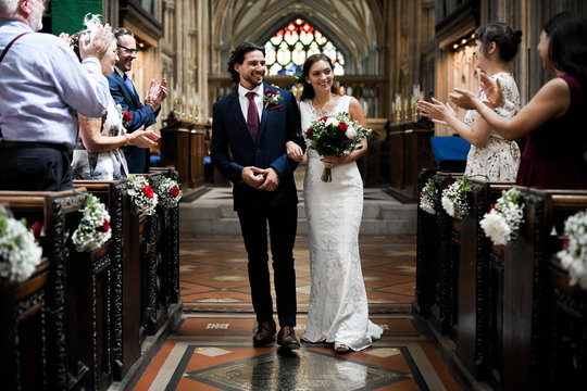 Newly Wed Couple Walking Down The Aisle