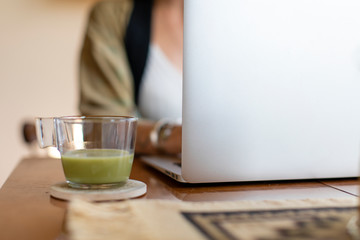 Relaxed woman working from home on her laptop