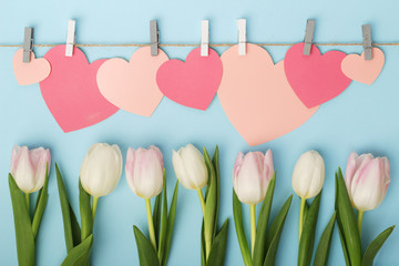 Tulips and pink paper hearts as Mother's Day decoration	