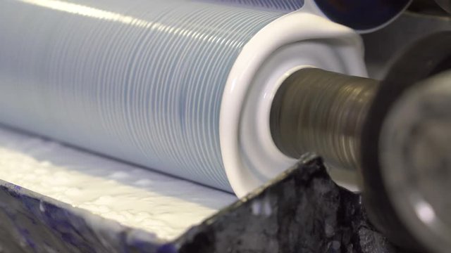Process of applying the adhesive solution on the printing press in the printing.
