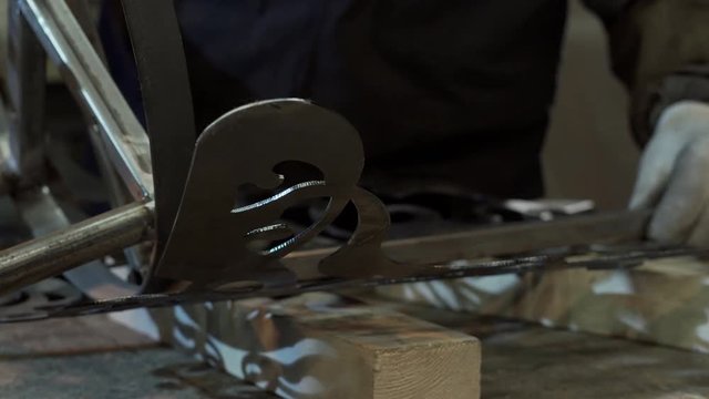 Blacksmith Assesses Strength And Symmetry To Connect The Last Detail