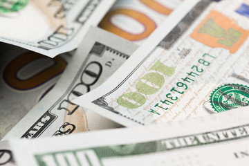 Close up heap of one hundred dollars, selective focus. Dollars, the us money background.