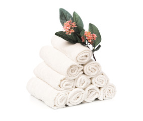 Obraz na płótnie Canvas set of white roll towels with flowers isolated on white.