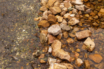 Stone stream in the mountains as a background