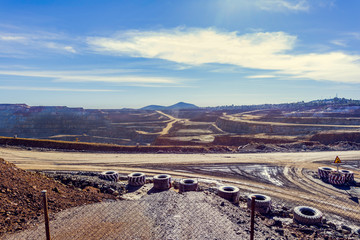 Opencast mining quarry from Riotinto with machinery  working.This area has been mined for copper and gold