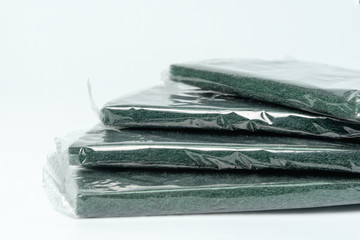 green dishwashing sponge isolated on white background