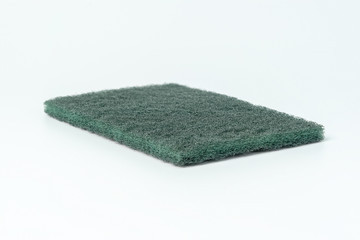 green dishwashing sponge isolated on white background