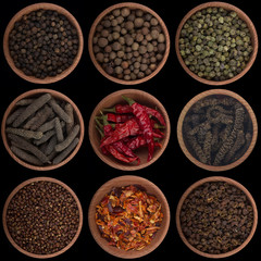 set of peppercorn in wooden cup isolated on black background