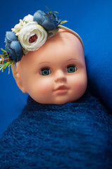 Baby doll toy photodraphed in a newborn style.