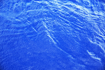 Blue surface of sea water, shot in the open sea directly from above