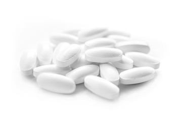 white medicine tablets in selective focus