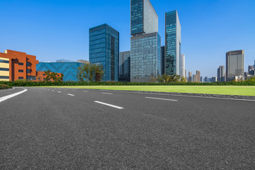 Empty asphalt road through modern city in Shanghai, China.