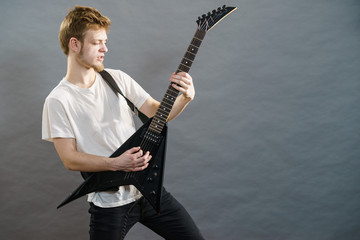 Man playing on electric guitar