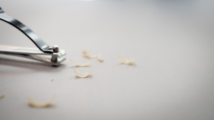 Nail close up and nail scissors blur background