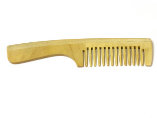 Wooden hairbrush on white isolated background