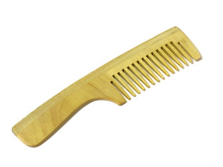 Wooden hairbrush on white isolated background