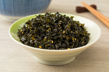 Bowl with Japanese seaweed with white sesame seed and plum