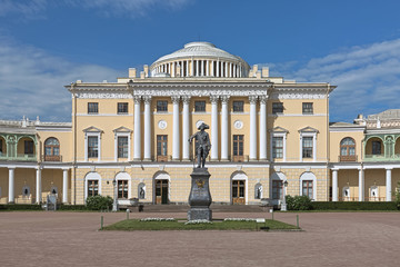 Fototapeta na wymiar Statue of Emperor Paul I in front of the Pavlovsk Palace, Saint Petersburg, Russia. The statue was erected in 1872. Text on pedestal reads: 