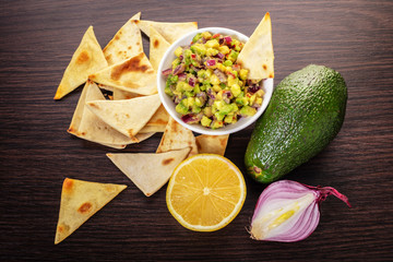guacamole with corn chips closeup