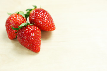 strawberry on wood table with copy space