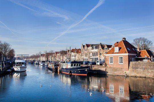 Historical houses and boats moored in Brielle