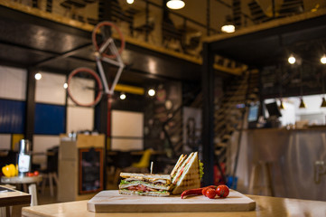 Club Sandwich on a wooden board