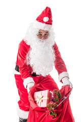 Santa Claus carrying big bag to delivery christmas gifts isolated on white background