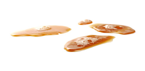 Spilled beer puddle with foam isolated on white background and texture