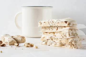 Turron or nougat with nuts on white background
