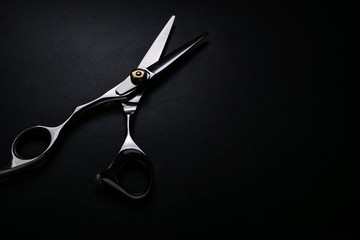 professional scissors on black background